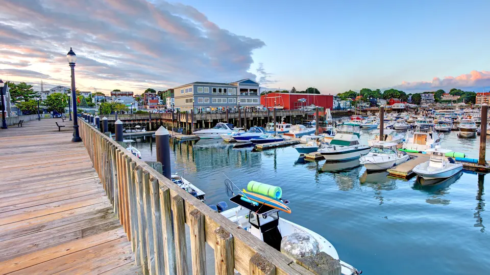 Beverly Harbor and waterfront boardwalk at dusk.