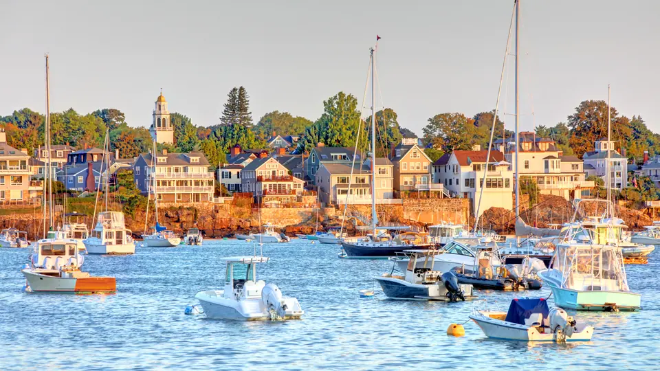 Marblehead Harbor with boats and historic shoreline homes.