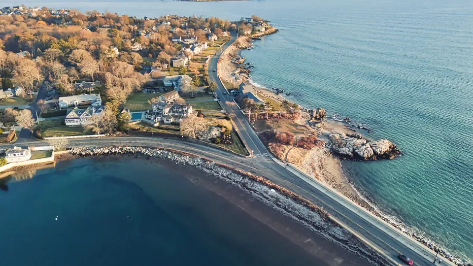 Aerial view of Nahant's causeway, beaches and rocky coastline.