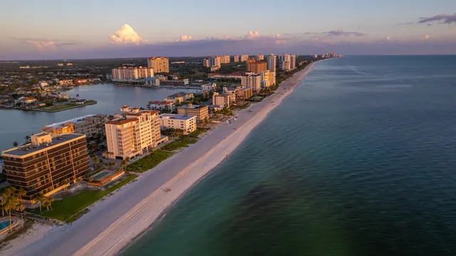Naples Gulf coastline and beachfront residences from above
