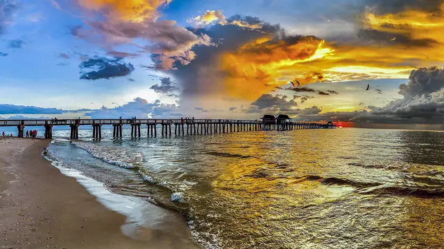 The Naples pier reaching into the Gulf of Mexico at sunset