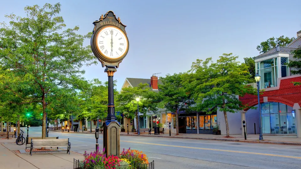 Wellesley town clock and downtown streetscape in Wellesley, Massachusetts.