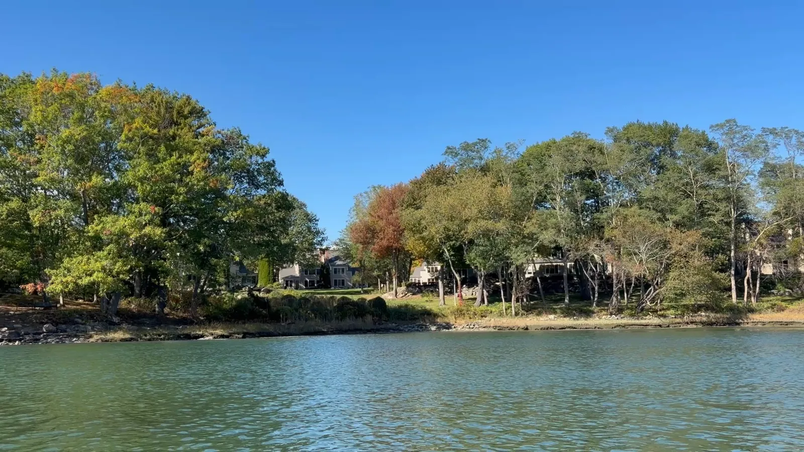 Tidewatch residences and wooded shoreline viewed from Sagamore Creek